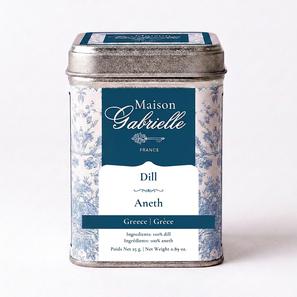 A metal tin of Maison Gabrielle Dill and Aneth seasoning from Greece, featuring a blue and white floral pattern with a dark blue label.