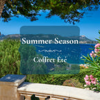 A scenic coastal landscape with blue sea, mountains, trees, and pink flowers, overlaid with a semi-transparent dark blue banner reading 'Summer Season' and 'Coffret Éte'.